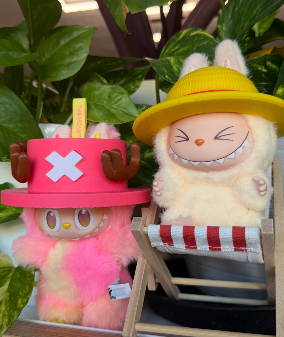 2 different style hats one p i e c e